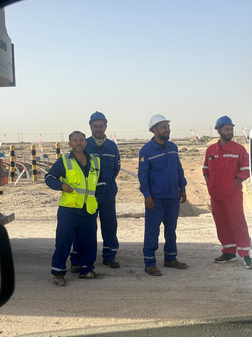 Field crew reviewing operations near a rig location