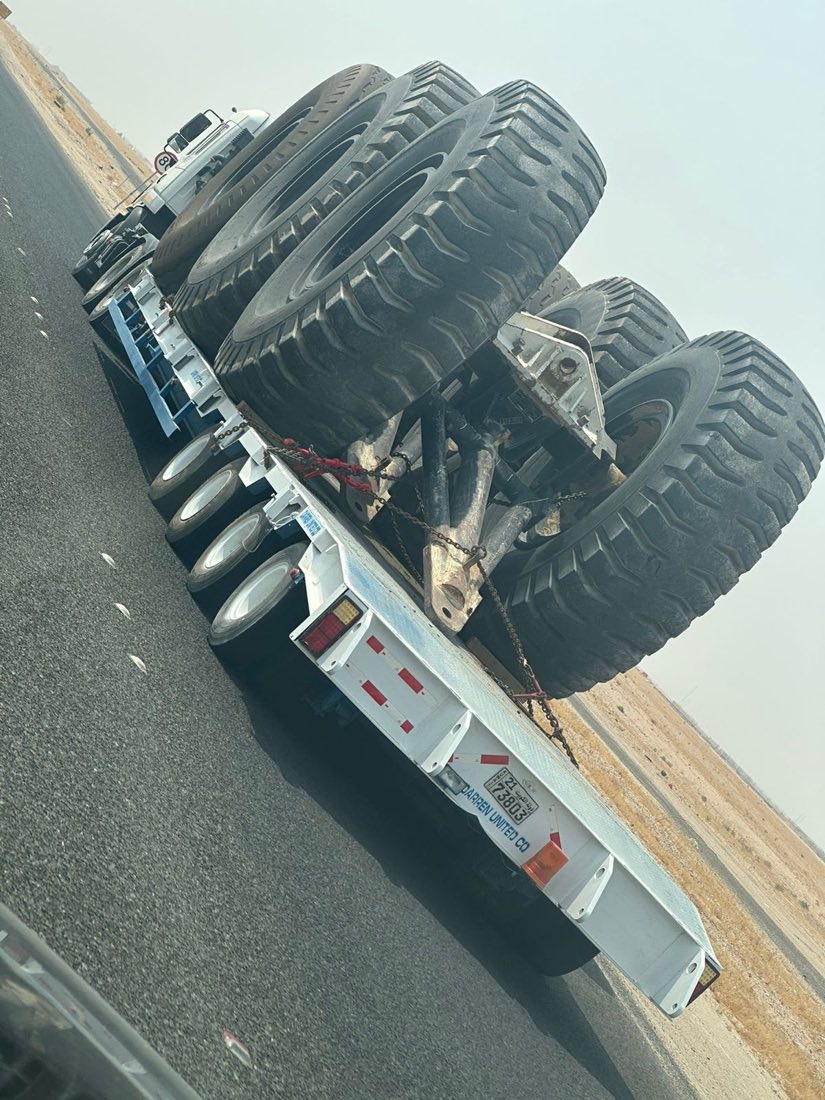 Darren United trailer transporting large equipment tires